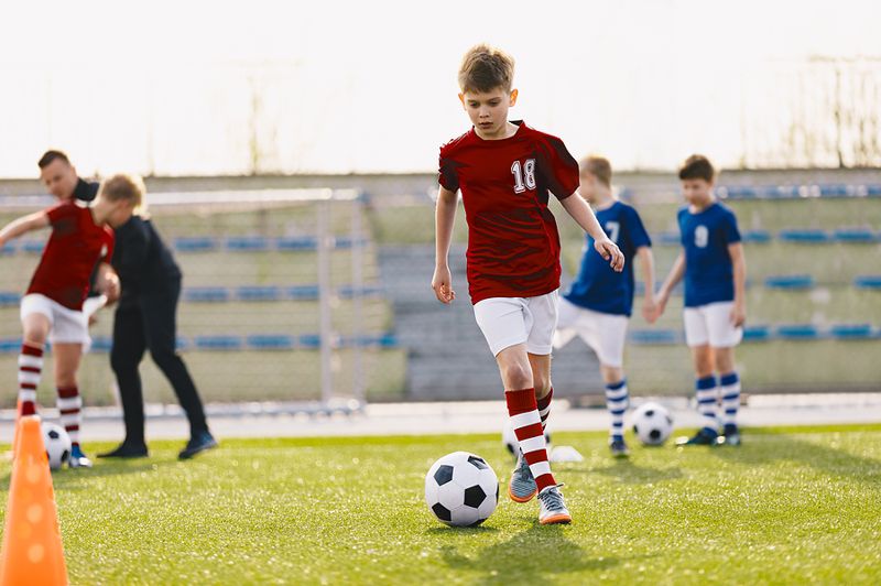 Child Playing Football