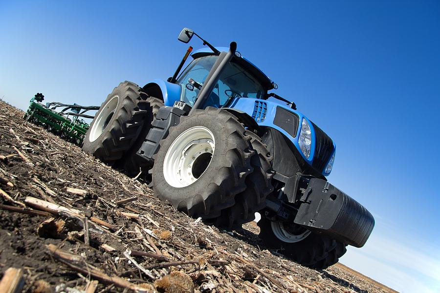 Blue Tractor Against Blue Sky