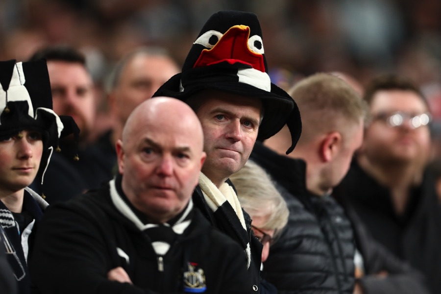 Newcastle fans with magpie hats